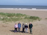 Five of our group on Chapel St Leonards beach.
