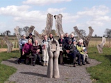 The sculpture and picnic table in Goltho Wood.