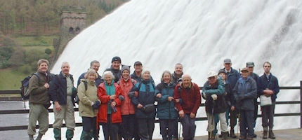 Sunday 18 April 2004. Group members on coach trip to Derwent Reservoir and moor. Image taken below Derwent Dam with flood water pouring over top.